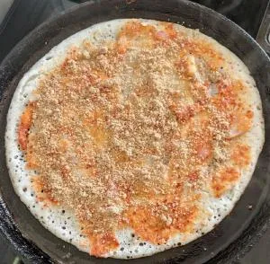 adding podi to erra karam dosa