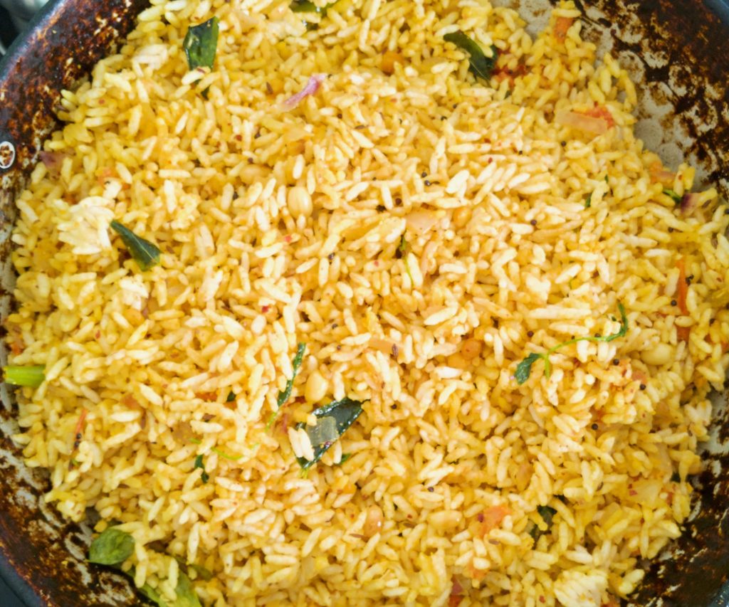 mixing og veggis and puffed rice uggani (tossed puff rice)